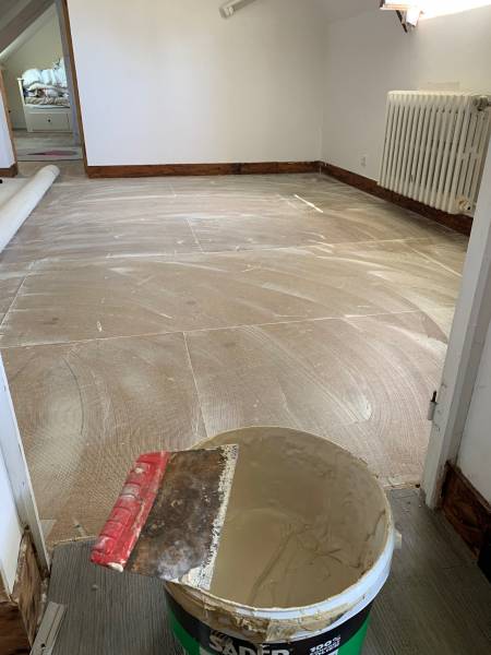 Pose collée de la moquette